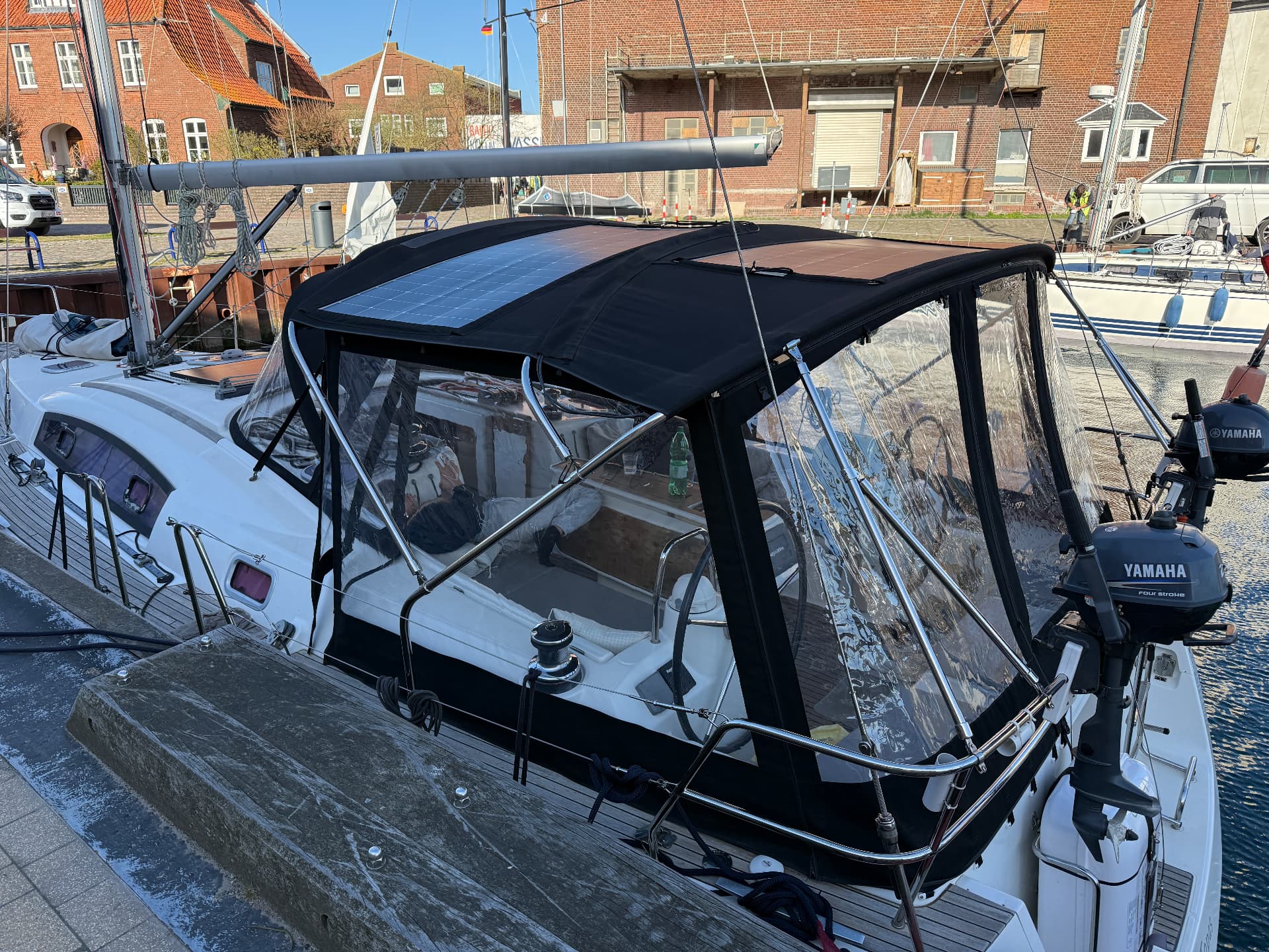 Full cockpit tent with solar panels seen from the pontoon