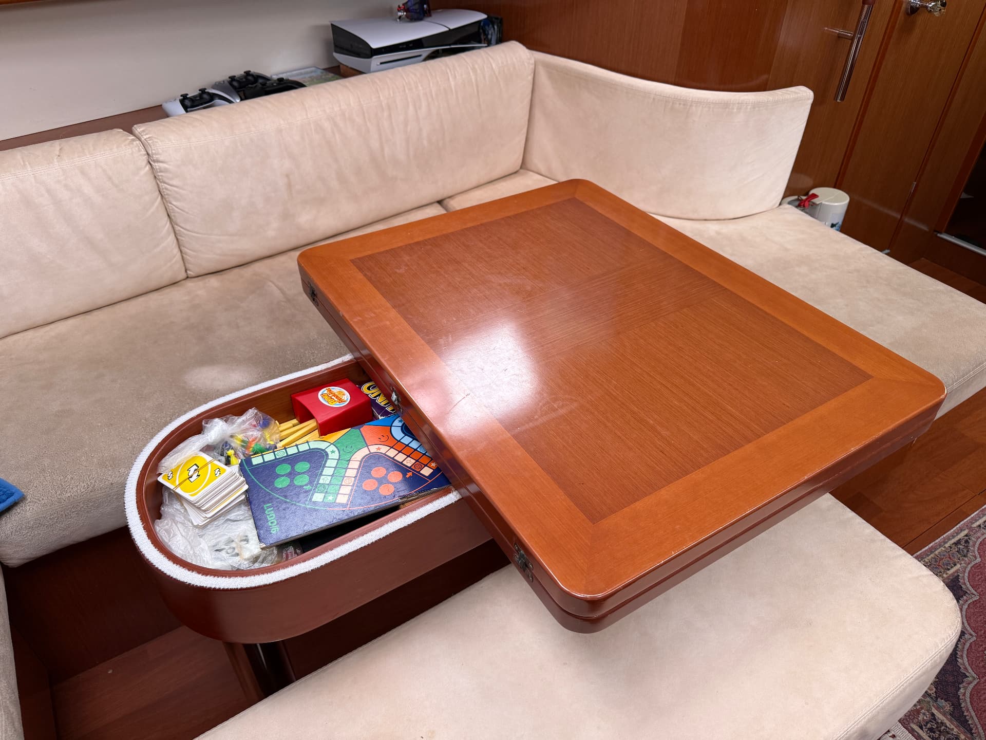 Saloon table with built-in storage locker
