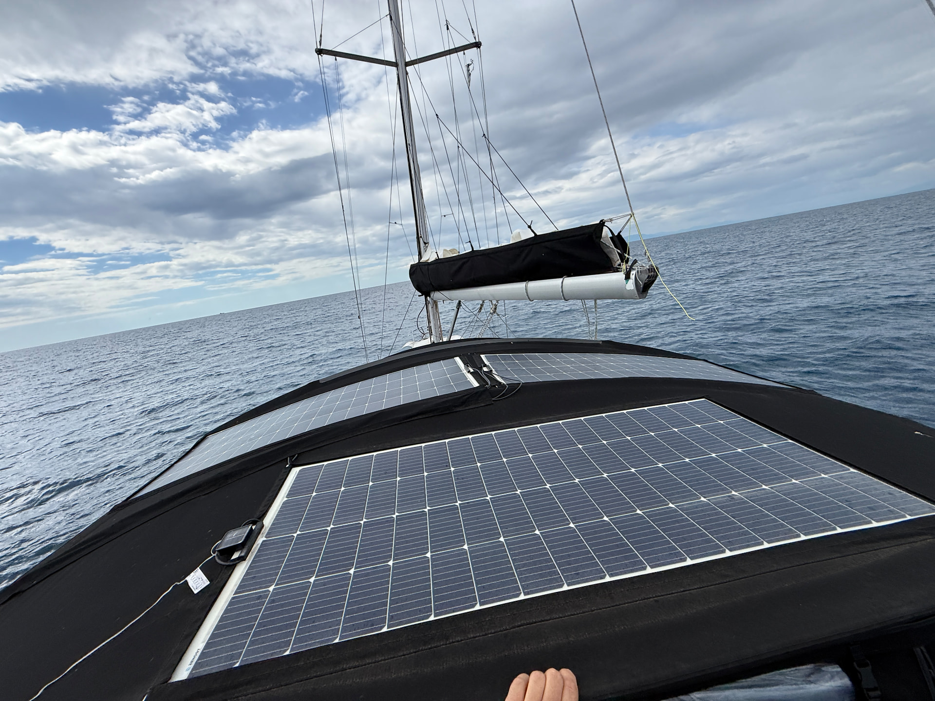 Solar panels on the bimini with open sea ahead while under way