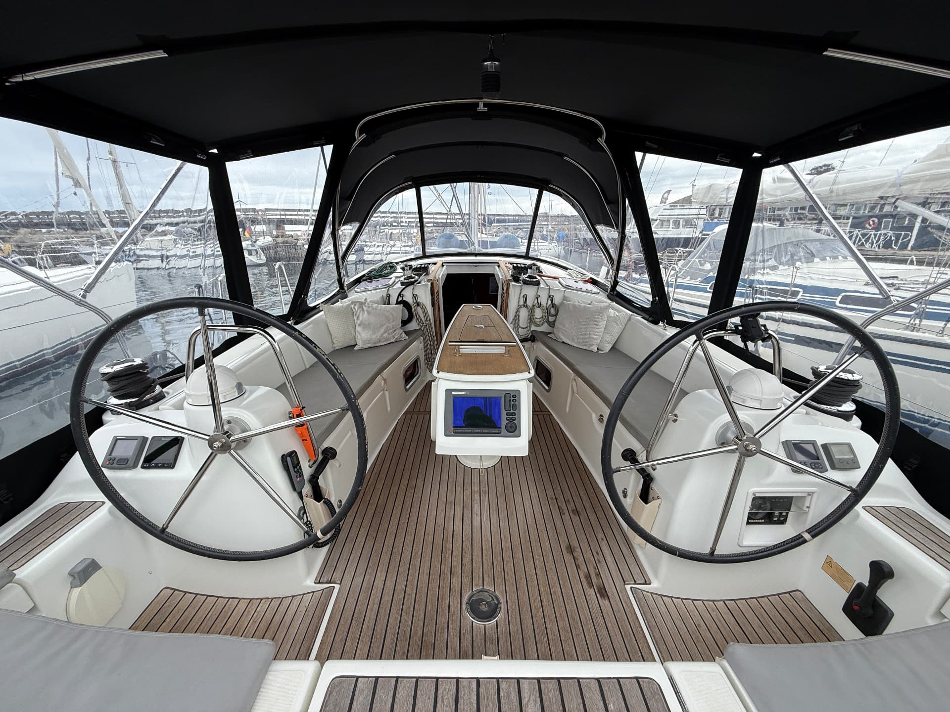 Topas cockpit with twin wheels, teak deck and cockpit tent