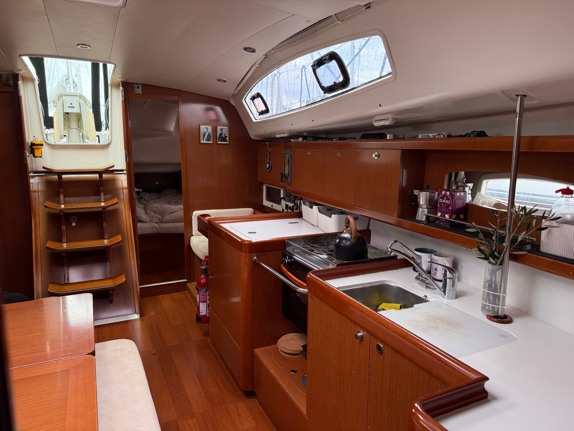 Galley with gas cooker, sink and passage to the forward cabin