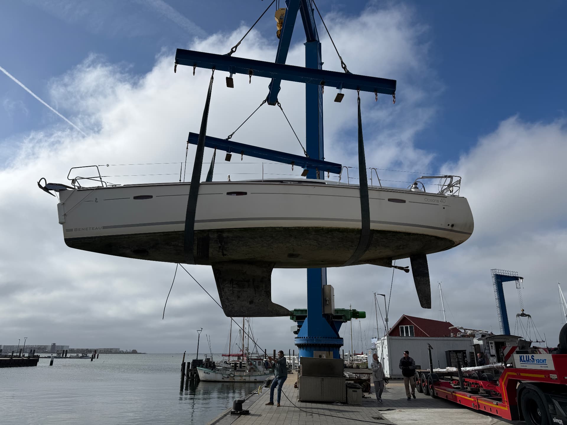 Topas lifted by crane showing keel and hull